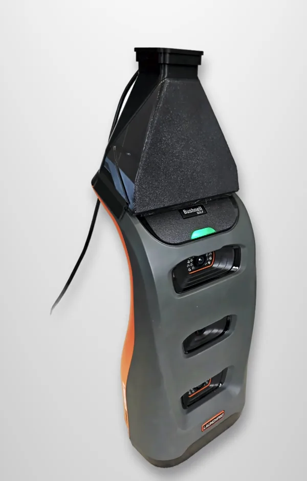 A black 3D-printed FreeDrop hood fitted on a grey Bushnell Launch Pro, its ready light on